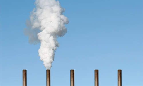 Photo of smokestack, greenwashing