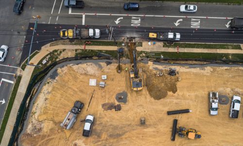 Aerial view of a construction site in an urban location.