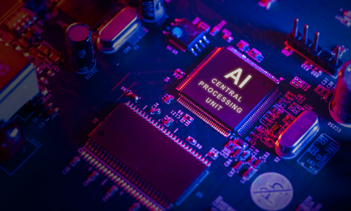Image of a computer chip with AI printed on it