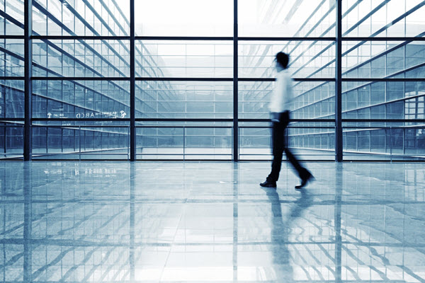 Person walking in office building image